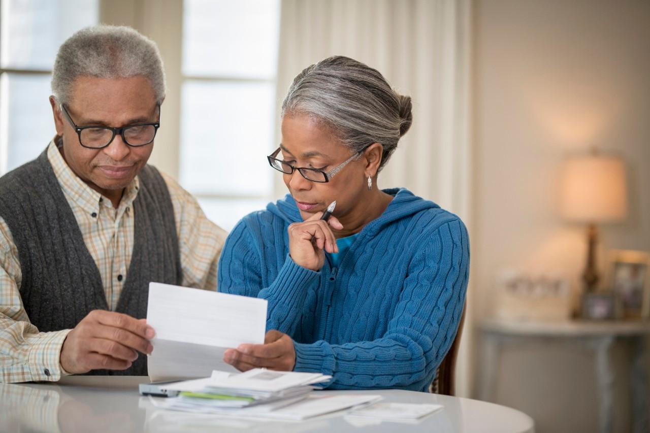 21 Jan 2014 --- Senior African American couple paying bills --- Image by © Terry Vine/Blend Images/Corbis