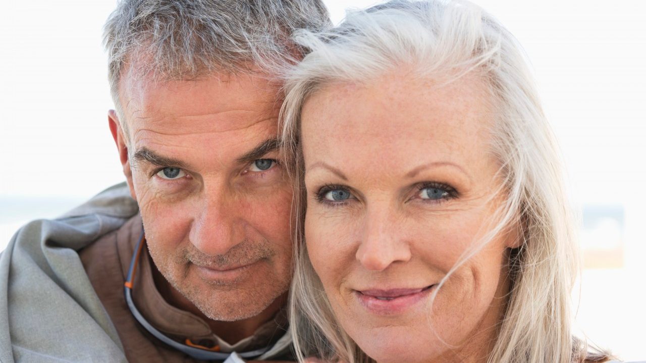 South Africa --- Portrait of a couple smiling on the beach --- Image by © Fabrice Lerouge/Onoky/Corbis