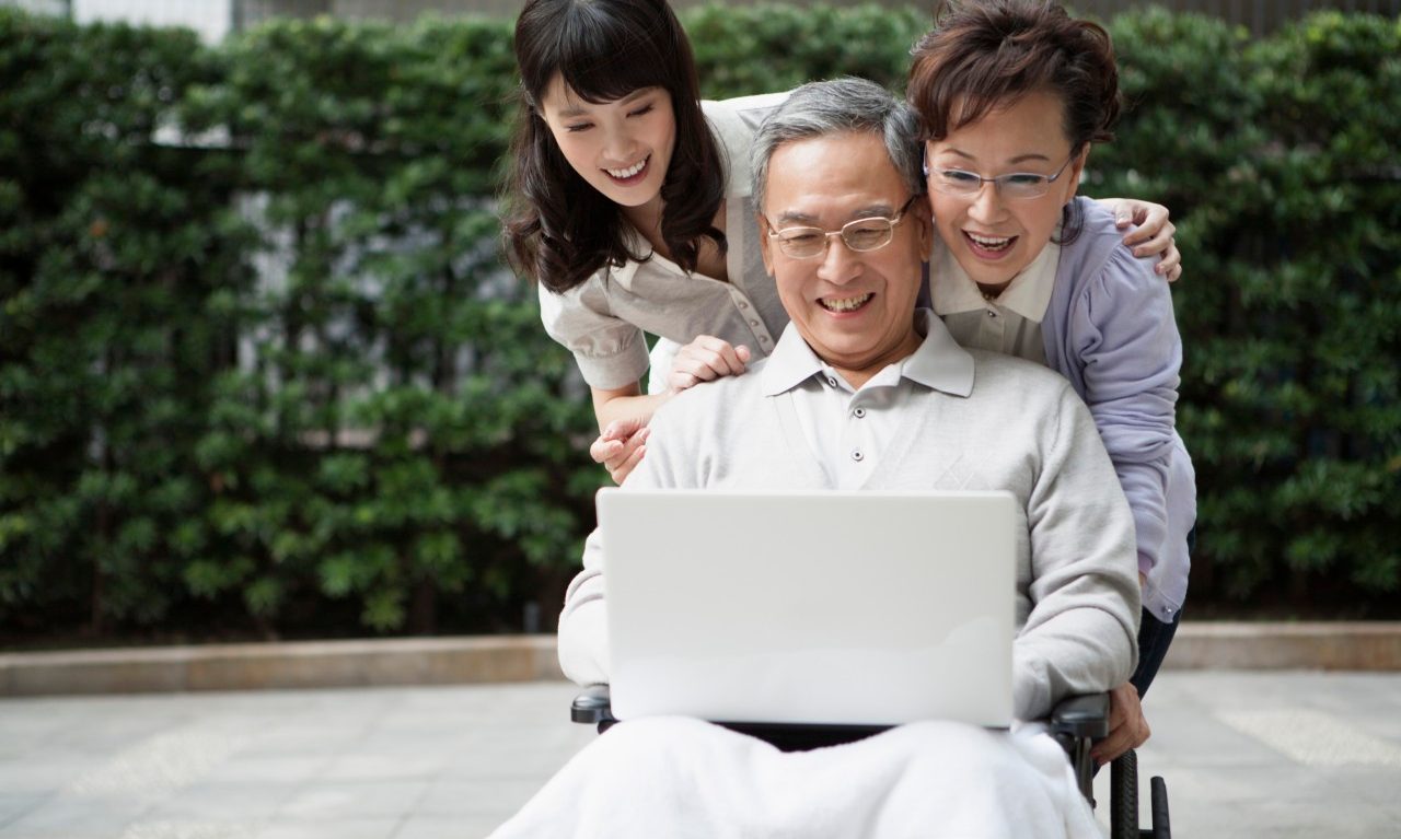 13 Mar 2014 --- Senior woman and young woman taking care of senior man with smile together --- Image by © IMAGEMORE3/Imagemore Co., Ltd./Corbis