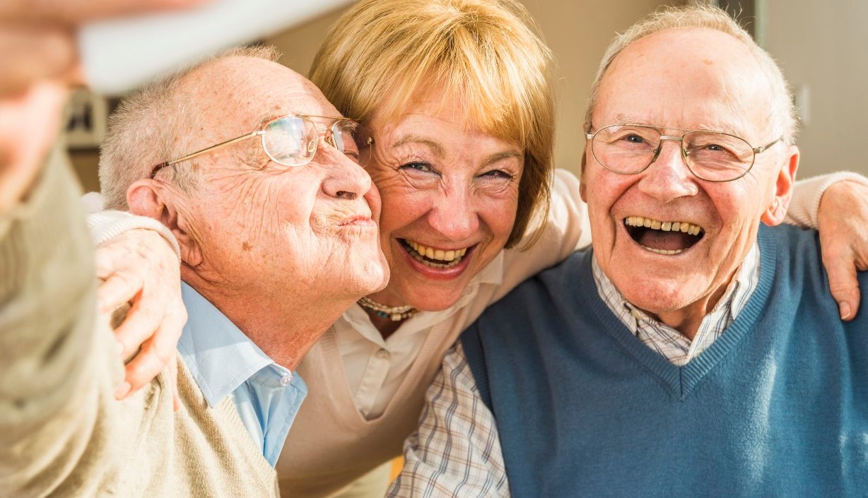 13 Feb 2015 --- Cheerful seniors taking selfie --- Image by © Uwe Umstätter/Westend61/Corbis