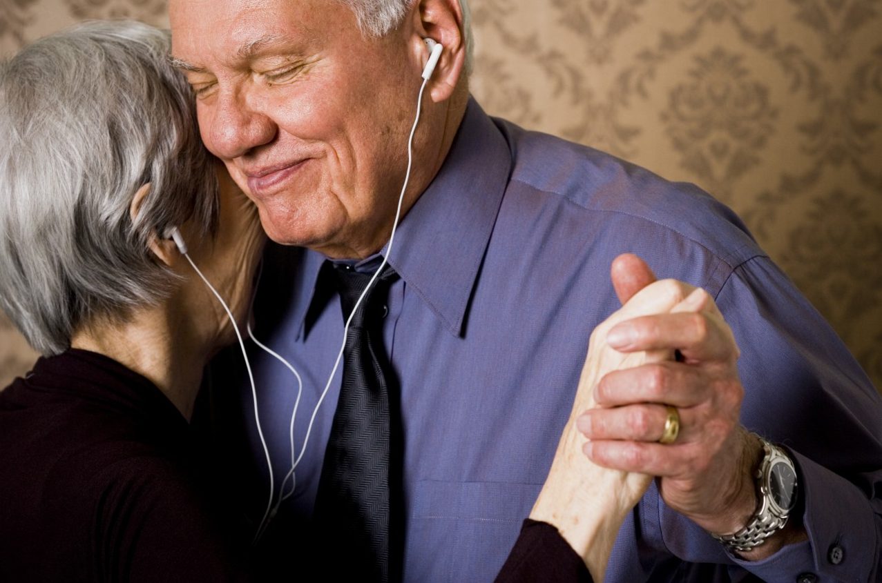 31 Mar 2006 --- Profile of an elderly couple dancing and listening to music --- Image by © Rubberball/Corbis