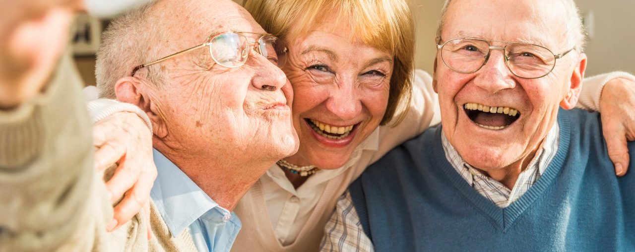 13 Feb 2015 --- Cheerful seniors taking selfie --- Image by © Uwe Umstätter/Westend61/Corbis