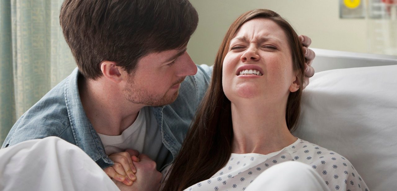 08 Feb 2012 --- Caucasian man helping girlfriend deliver baby --- Image by © KidStock/Blend Images/Corbis