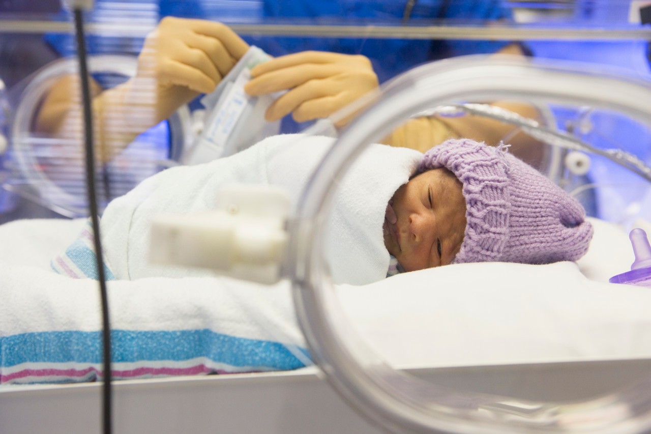 Premature Baby in Incubator --- Image by © Corbis