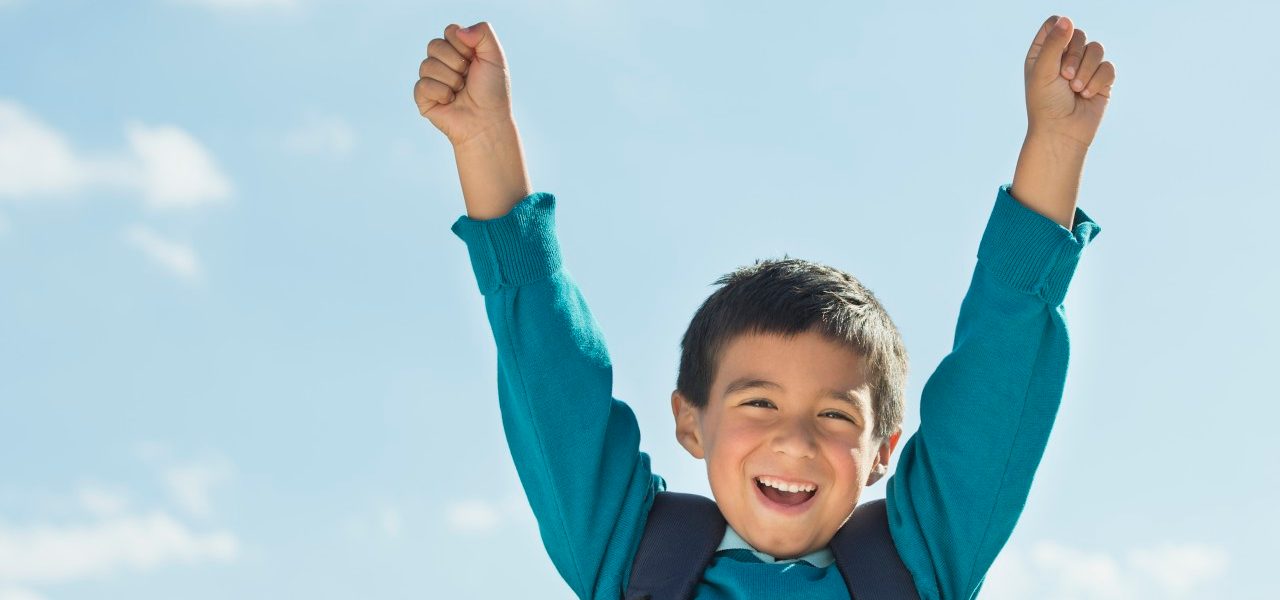0042-11-30T00:00:00.000Z Boy (6-7) wearing backpack punching air --- Image by © Tetra Images/Corbis