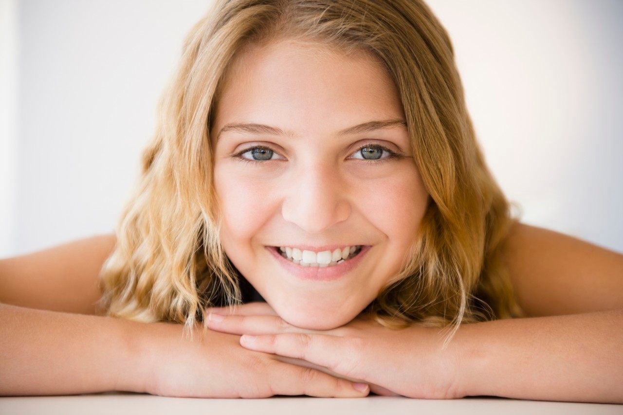 18 Jun 2014 --- Portrait of smiling girl (12-13) --- Image by © Jamie Grill/Tetra Images/Corbis