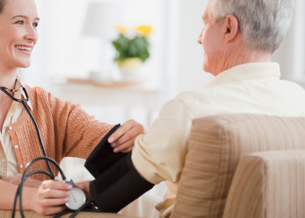 0042-11-30T00:00:00.000Z Nurse taking senior man's blood pressure --- Image by © Tetra Images/Corbis