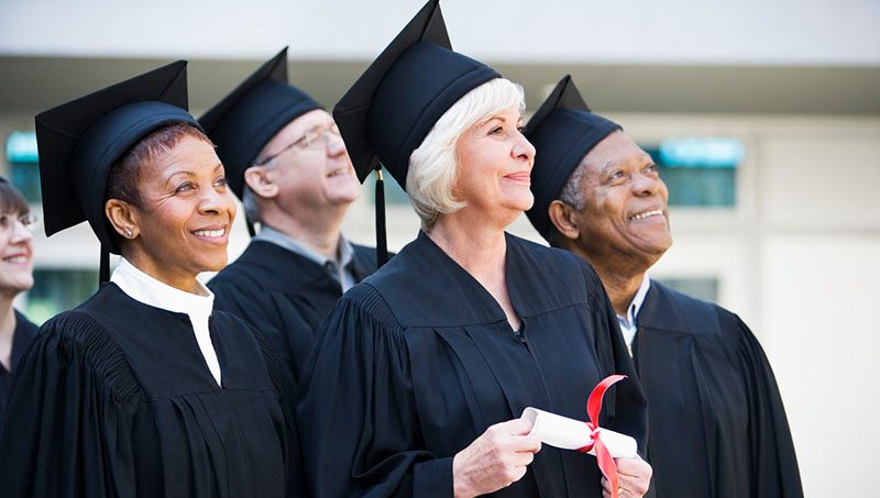 42-18789873 Senor Students Graduating --- Image by © Rob Melnychuk/Corbis