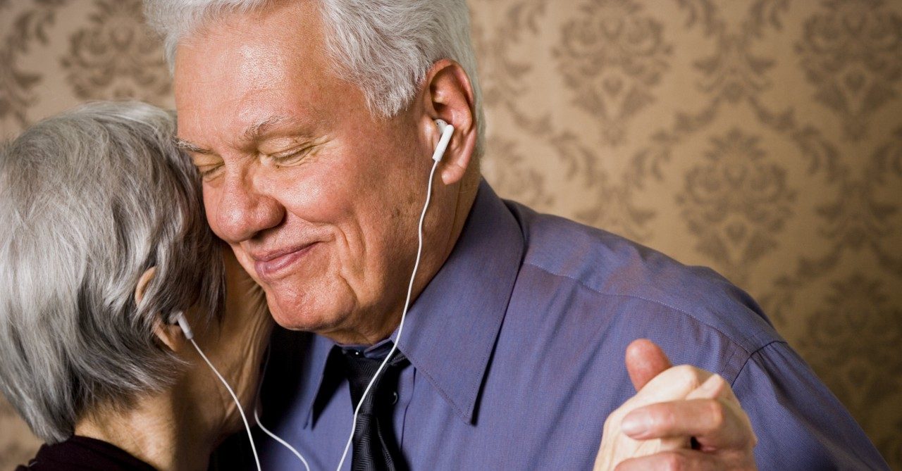 A happy older couple dancing