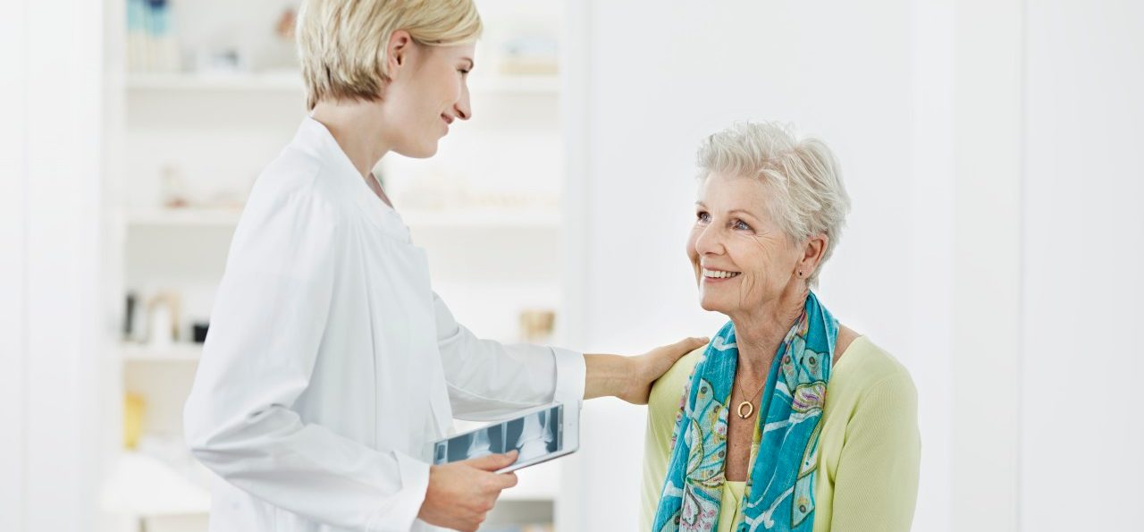 0042-11-30T00:00:00.000Z Doctor talking with senior patient --- Image by © Roger Richter/Corbis