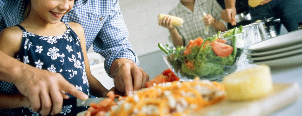 0042-11-30T00:00:00.000Z Family preparing the food, part of --- Image by © Alexander Scott/Corbis