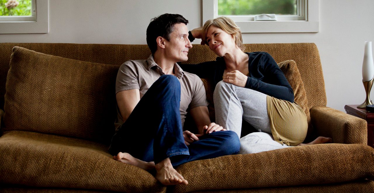 24 May 2012 --- Mature couple relaxing in sofa --- Image by © Cavan Images/Corbis