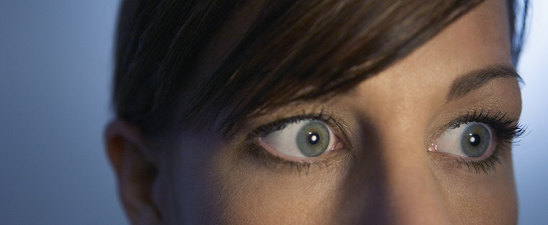 42-19748577 Scared wide-eyed woman --- Image by © Monalyn Gracia/Corbis