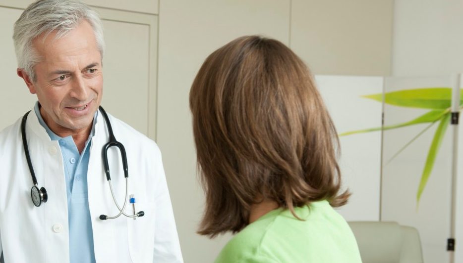 0042-11-30T00:00:00.000Z Doctor and female patient shaking hands --- Image by © Petrol/Corbis
