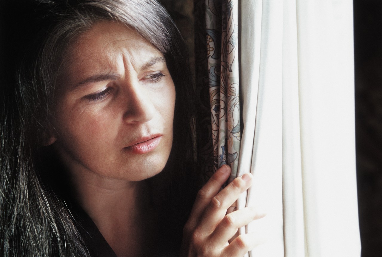 Peeking out the window --- Image by © Corbis