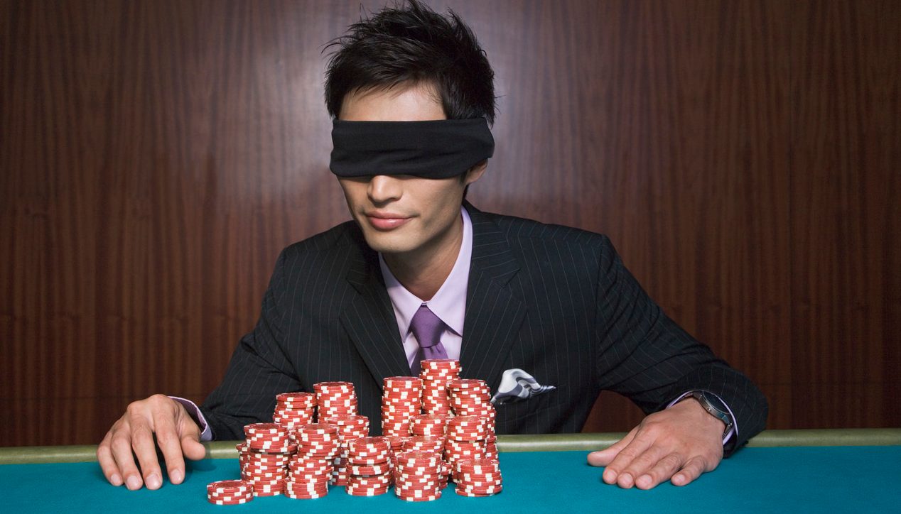 Blindfolded Young Man at Casino --- Image by © Corbis