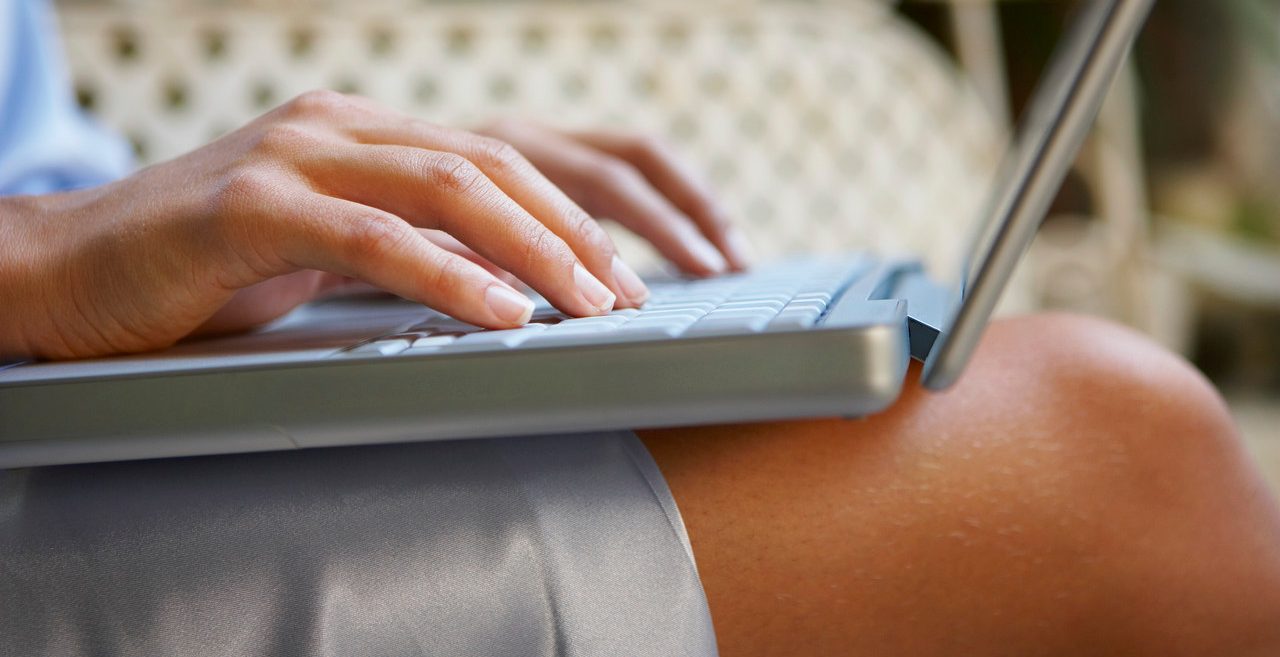 Woman Using Laptop --- Image by © Ant Strack/Corbis