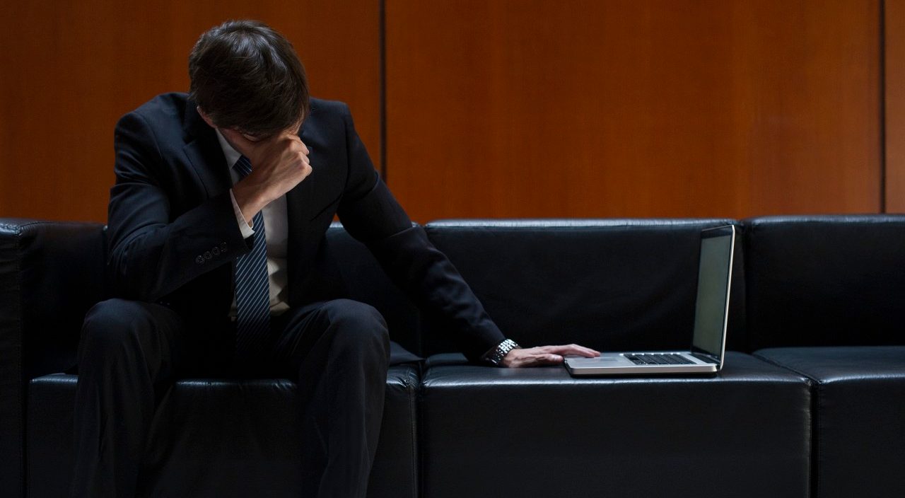 0042-11-30T00:00:00.000Z 15 Feb 2014 --- Businessman covering eyes with hand in disbelief --- Image by © Frederic Cirou/PhotoAlto/Corbis