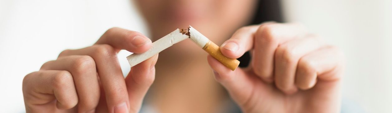 0042-11-30T00:00:00.000Z 15 Apr 2014, Jersey City, New Jersey, USA --- Mixed race teenage girl breaking cigarette in half --- Image by © JGI/Tom Grill/Blend Images/Corbis
