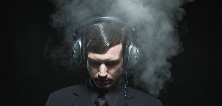 Man Listening to Headphones --- Image by Â© B. Pepone/Corbis