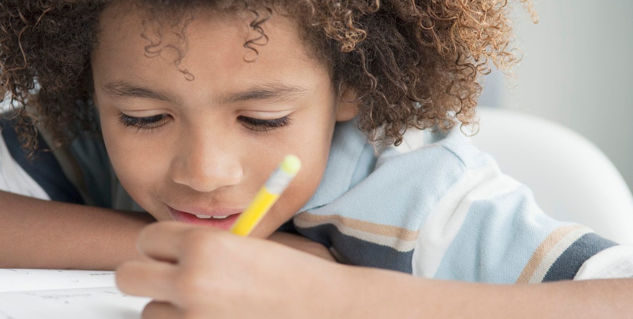 0042-11-30T00:00:00.000Z Little boy writing --- Image by © Beau Lark/Corbis