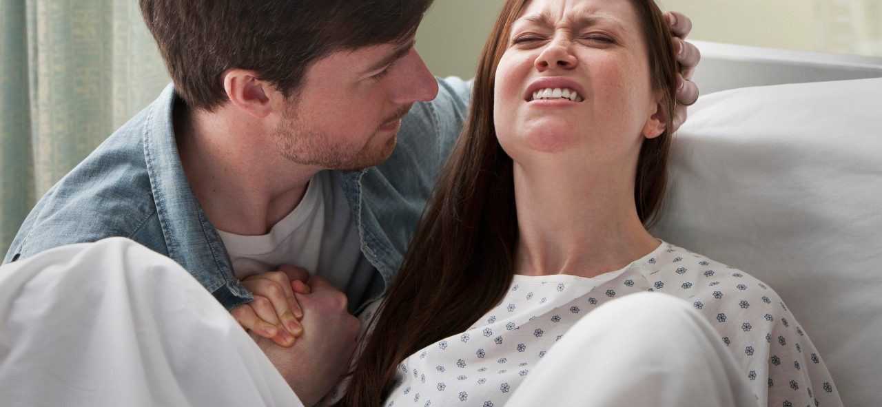 08 Feb 2012 --- Caucasian man helping girlfriend deliver baby --- Image by © KidStock/Blend Images/Corbis