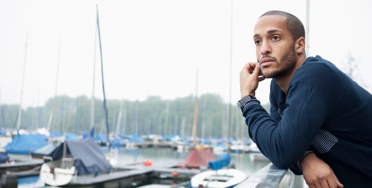 17 May 2013, Düsseldorf, Germany --- Portrait of young man in marina --- Image by © Attia-Fotografie/Corbis