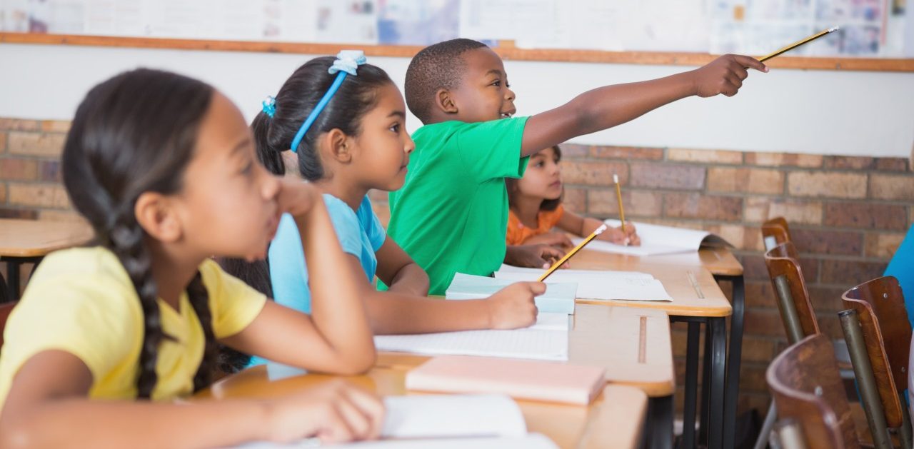 0042-11-30T00:00:00.000Z 11 May 2014 --- Cute pupil raising hand in classroom --- Image by © Wavebreak Media LTD/Wavebreak Media Ltd./Corbis