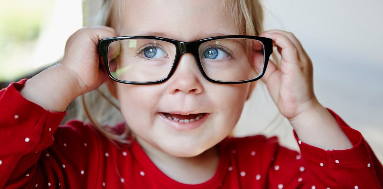 03 May 2014 --- Young girl wearing glasses --- Image by © Judith Wagner Fotografie/Corbis