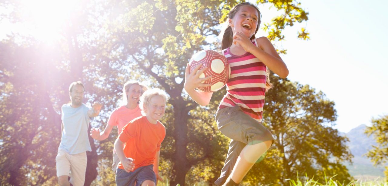 0042-11-30T00:00:00.000Z 16 Sep 2014 --- Grandparents and grandchildren running with ball in rural field --- Image by © Ian Lishman/Juice Images/Corbis