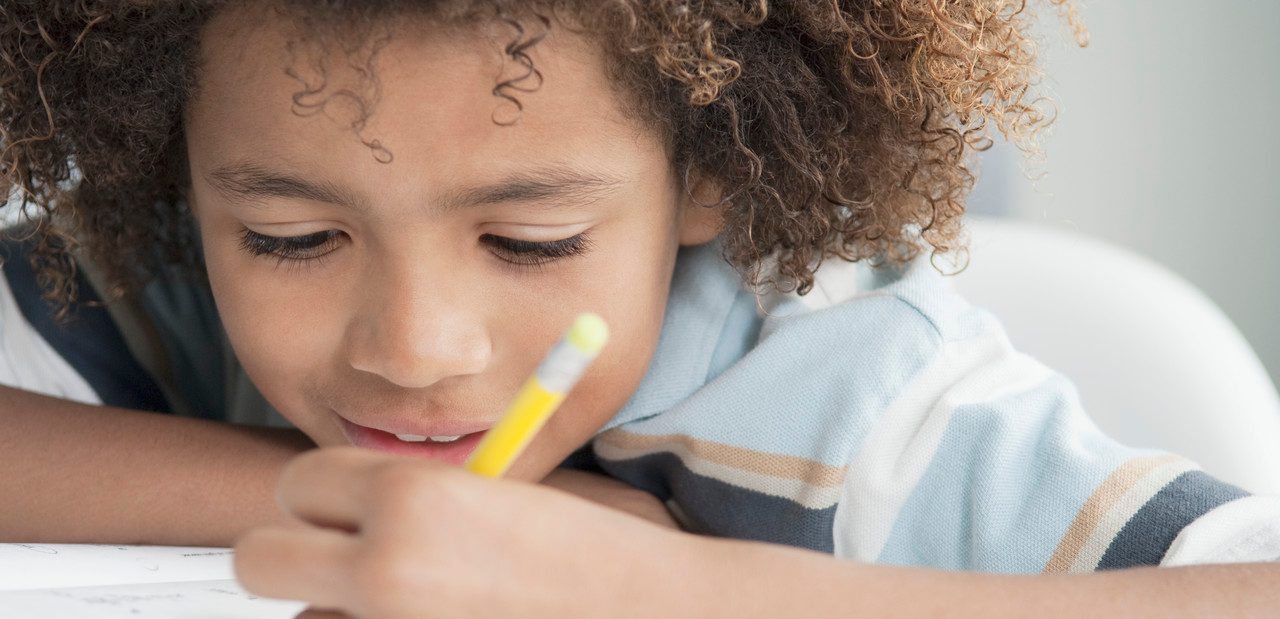 0042-11-30T00:00:00.000Z Little boy writing --- Image by © Beau Lark/Corbis