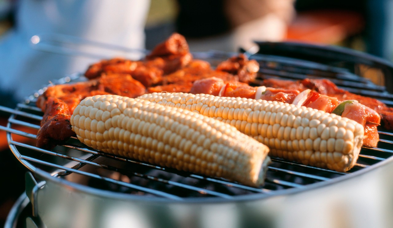 Corncobs and meat on grill --- Image by © Rainer Holz/Corbis