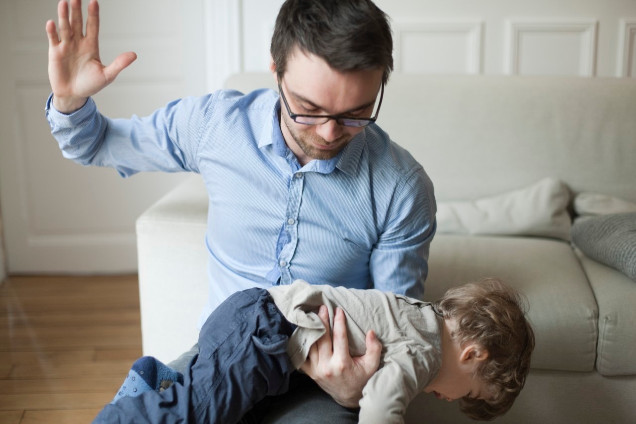 Father disciplining toddler --- Image by © Sandro Di Carlo Darsa/PhotoAlto/Corbis