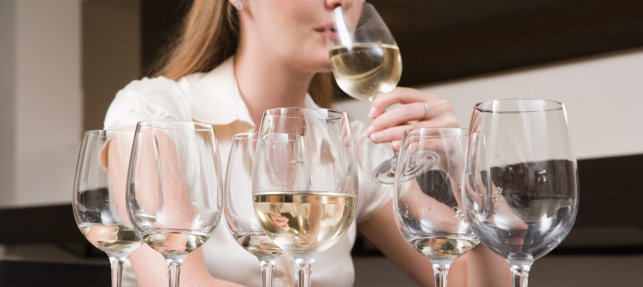 Woman binge drinking wine --- Image by © Image Source/Corbis