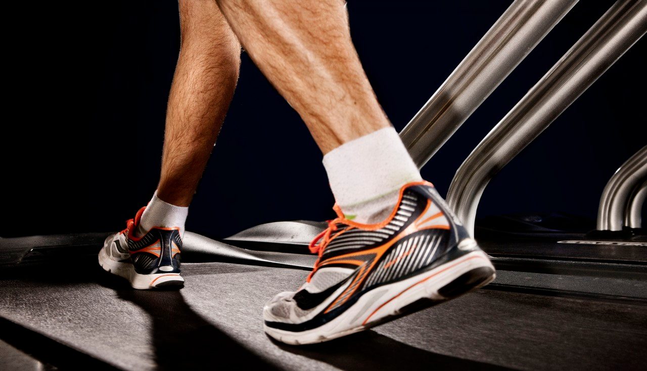 21 Jan 2014 --- Close up of male legs running on gym treadmill in altitude centre --- Image by © Vincent Starr Photography/Corbis
