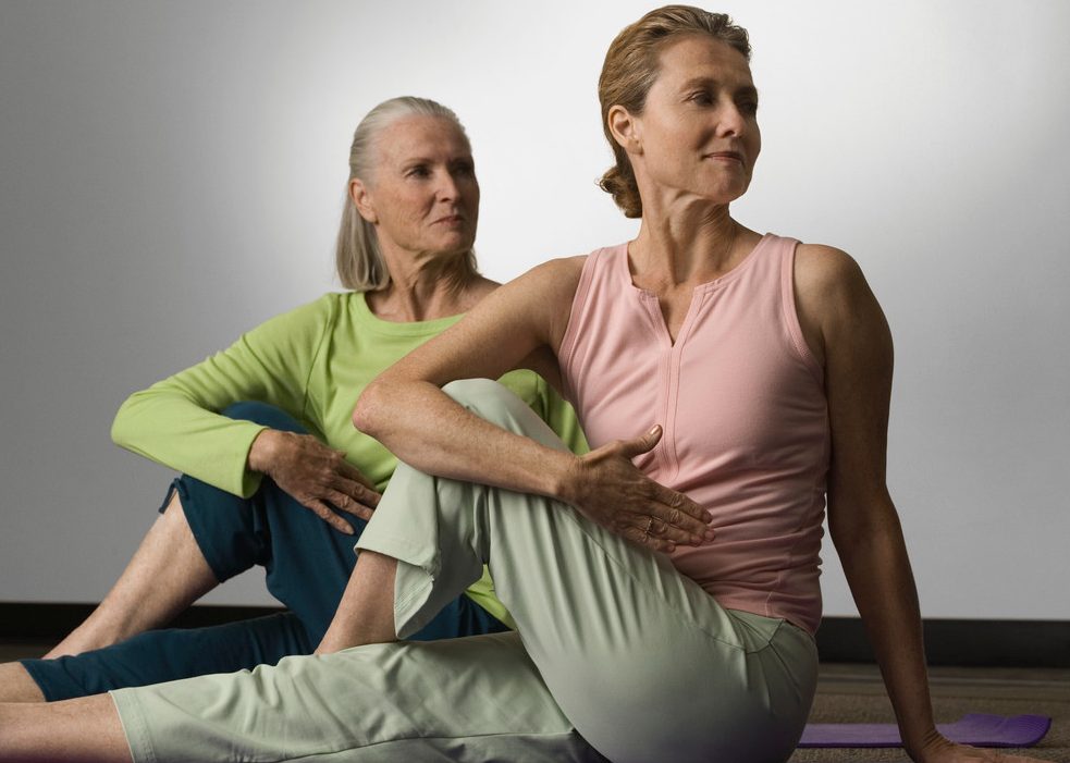 0042-11-30T00:00:00.000Z Women Doing Yoga --- Image by © Robert Michael/Corbis