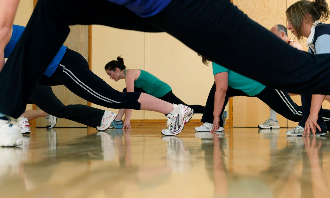 Aerobic exercise at gym --- Image by © Colin Hawkins/cultura/Corbis