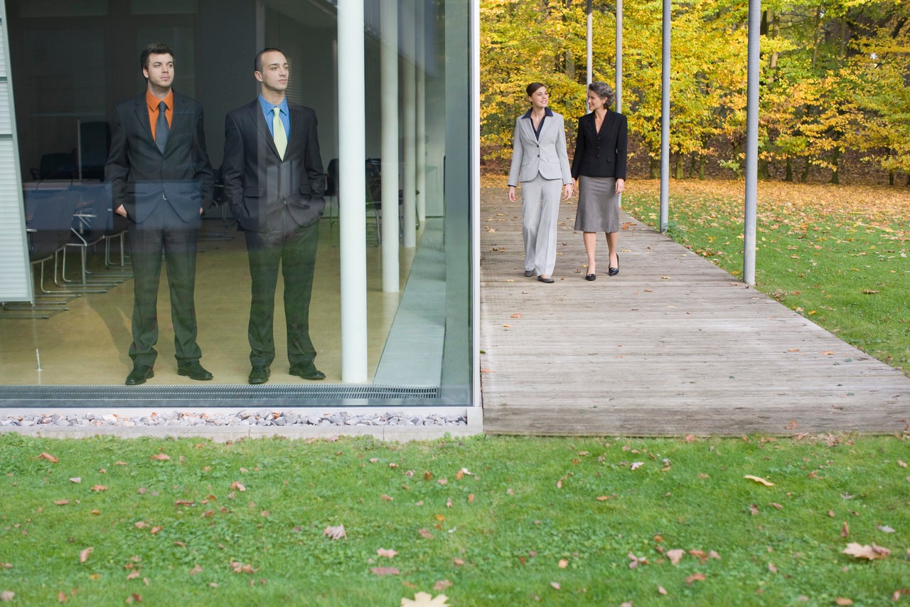 Businesswomen Walking Beside a Building --- Image by © Heide Benser/Corbis