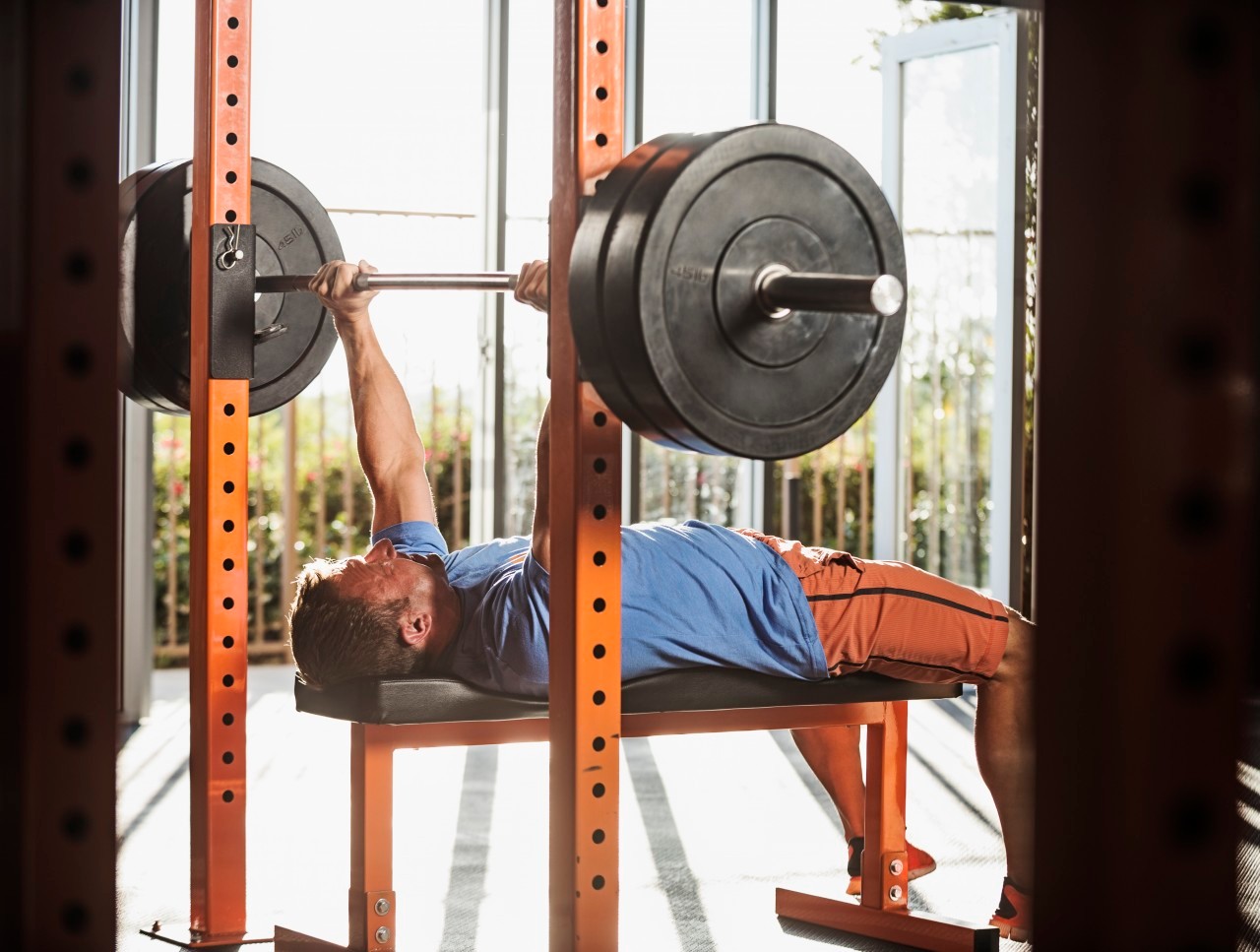 13 Jun 2014 --- Mature man bench pressing --- Image by © Erik Isakson/Tetra Images/Corbis