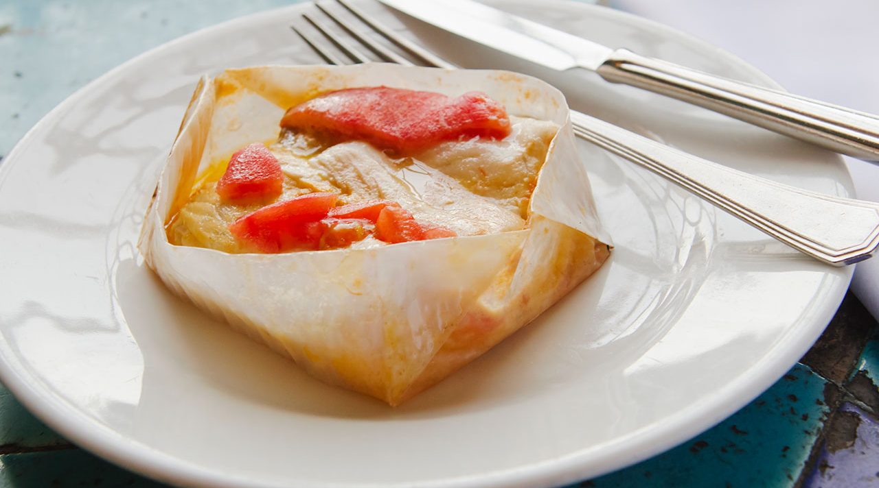 Fish in parchment with vegetables