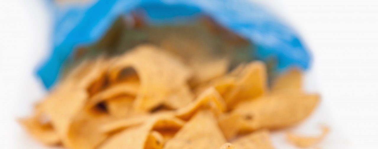 Ireland --- Open bag of crisps --- Image by © Wavebreak Media LTD/Wavebreak Media Ltd./Corbis