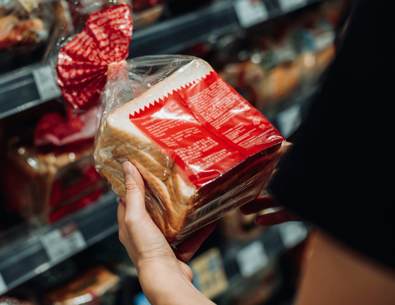 A woman reading a food label