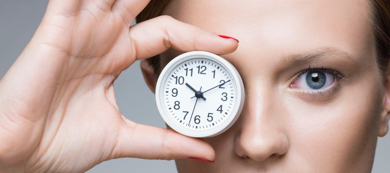 Woman contemplating body clock --- Image by © James Lightbown/London, 2014/Corbis