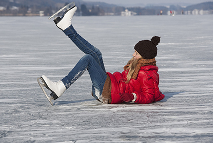 Austria --- Austria, Teenage girl fallen on ice rink while skating --- Image by Â© Wolfgang WeinhÃ¤upl/Westend61/Corbis