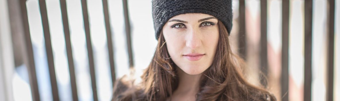 02 Mar 2015 --- Portrait of young woman wearing knit hat --- Image by © Steve Prezant/Corbis